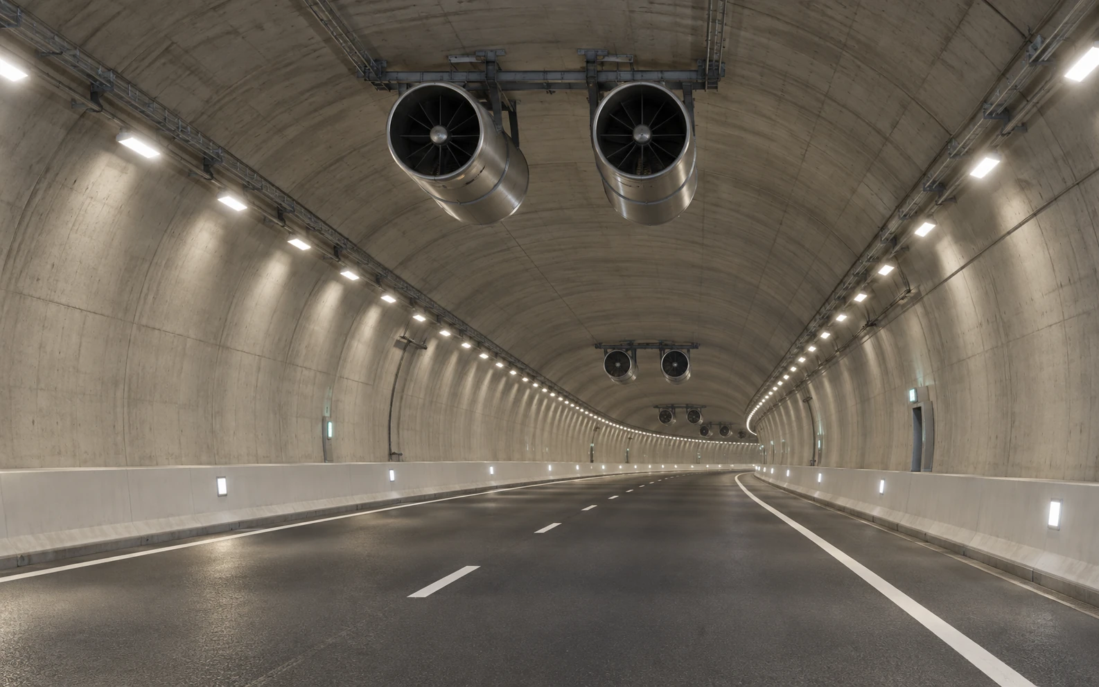 Completed road tunnel ventilation with paired ceiling-mounted jet fans installed at intervals